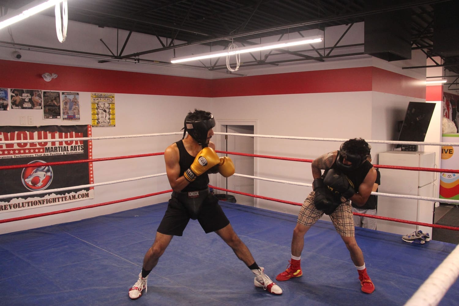 Boxers working on footwork and movement inside the ring
